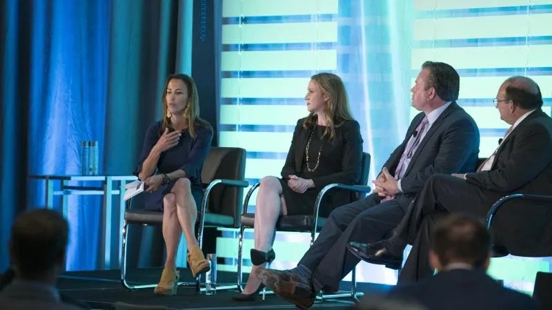 Panel discussion on stage at the Interact Conference